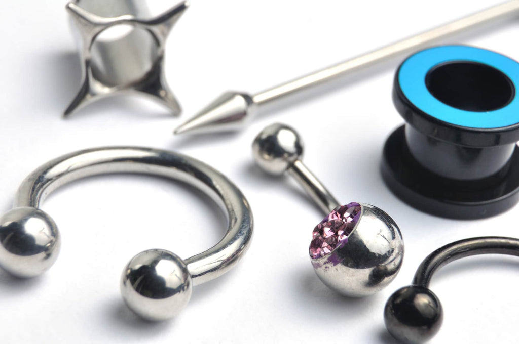 Mixed Piercing Jewellery of silver horseshoe pink crystal belly button ring and blue ear tunnel