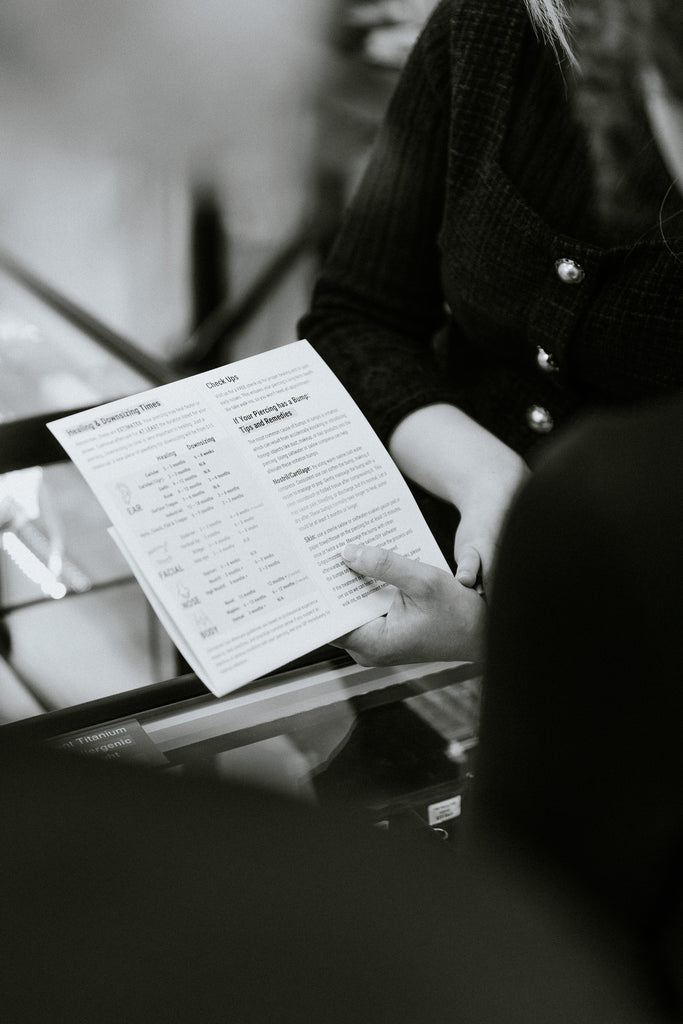 Pheenix-team-explaining-aftercare-piercing-prep