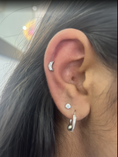 Gurpreet-Kaur-Bharaj-showing-off-pheenix-piercing-studio-piercing